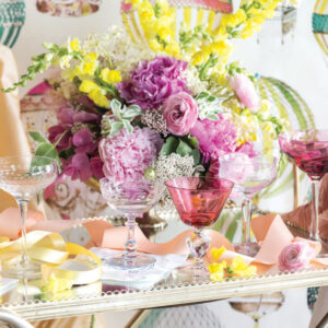 Flowers with yellow and pink and drinking glasses