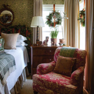 Bedroom with hanging wreath and chair