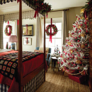 Bedroom with hanging wreath and christmas tree