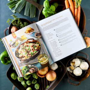 Seasoned styled internal spread surrounded by fresh vegetables