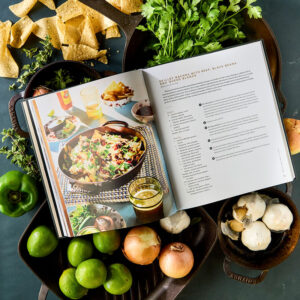 Seasoned styled internal spread surrounded by fresh vegetables