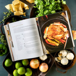 Seasoned styled internal spread surrounded by fresh vegetables