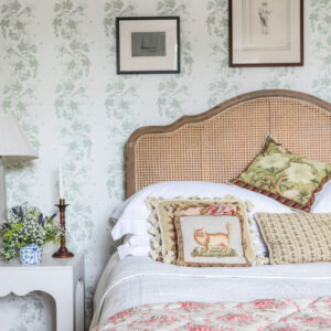 Bedroom with nightstand, frame, and wallpaper