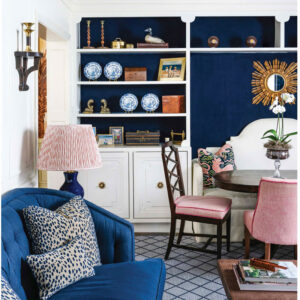 Dining room with blue chair and pink accents