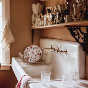 White farm sink with dishes
