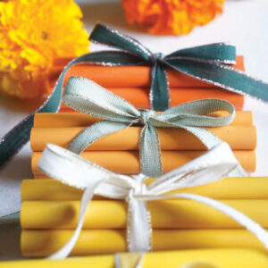 Orange and yellow wax with ribbon