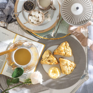 Scones on plate with side of tea
