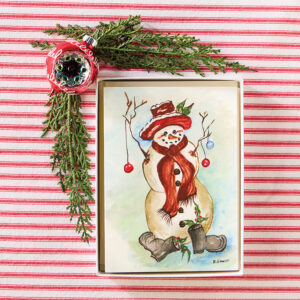 Holiday notecards on red and white stripe fabric with holly and ornament