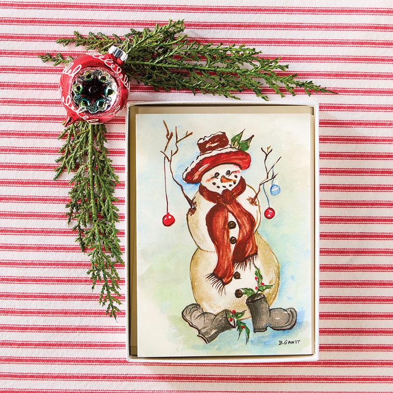 Holiday notecards on red and white stripe fabric with holly and ornament