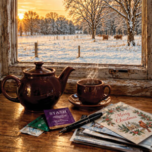 Teapot on a table with Christmas cards